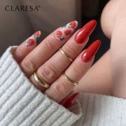 Claresa lakier hybrydowy "Autumn Crush 2". Stylizacja manicure w stylu jesiennym na długich paznokciach. Kolor został wykorzystany do stworzenia wzoru dyń.