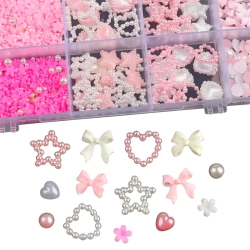 Clavier ozdoby do paznokci nr 84 3D w kasetce. Różne kształty: gwiazdka, kokardka, serduszko, kwiatek. Białe tło.